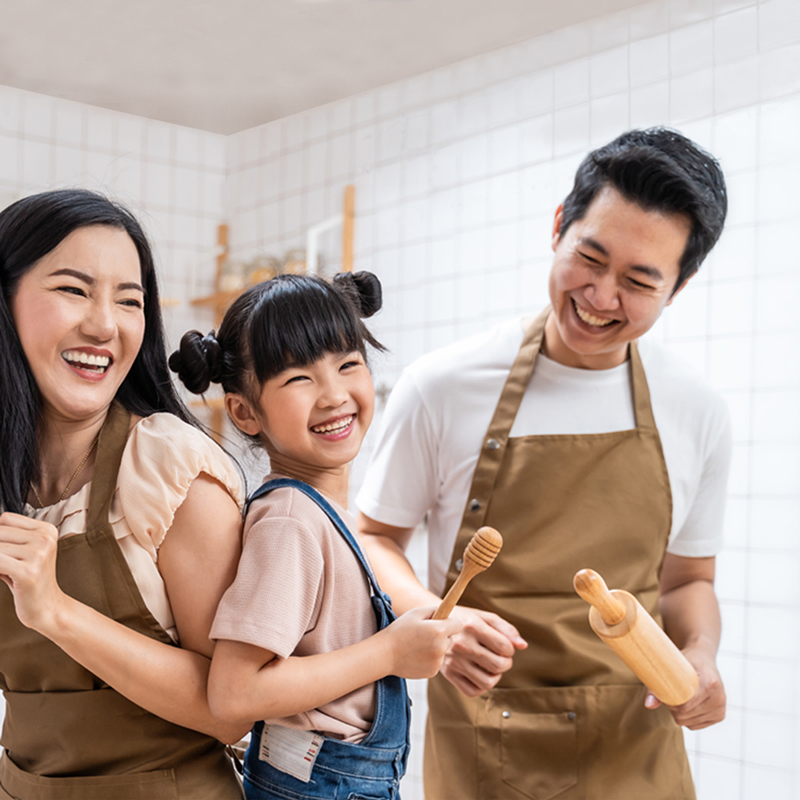 Hero Banner-Sep2022-1250x1250 A family is laughing in a kitchen